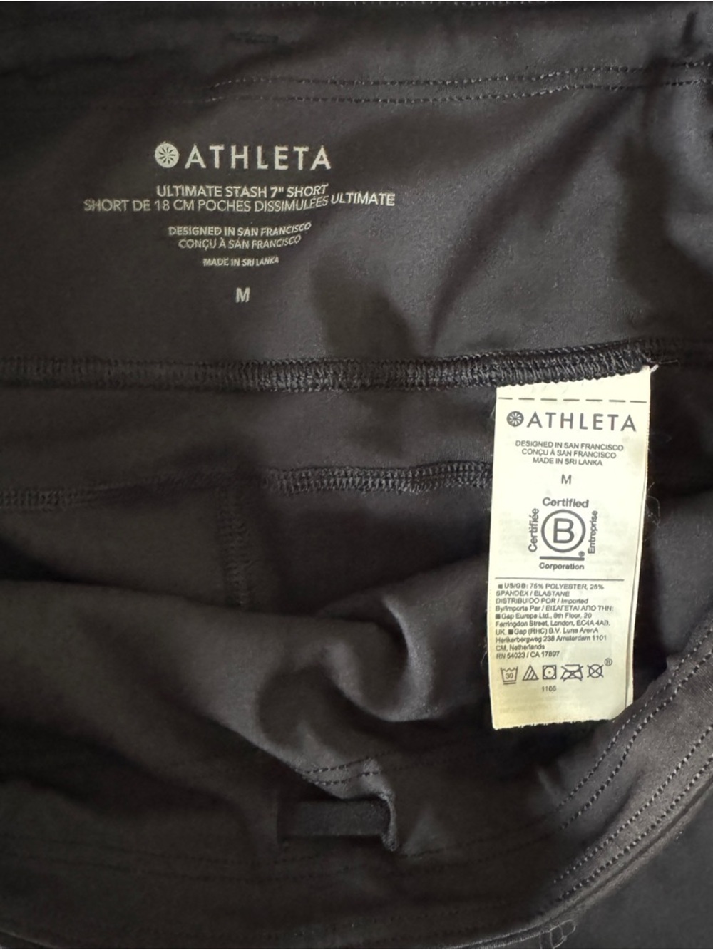 Athleta Ultimate Stash Black High-Rise Bike Shorts with Side Pockets - Picture 3 of 4